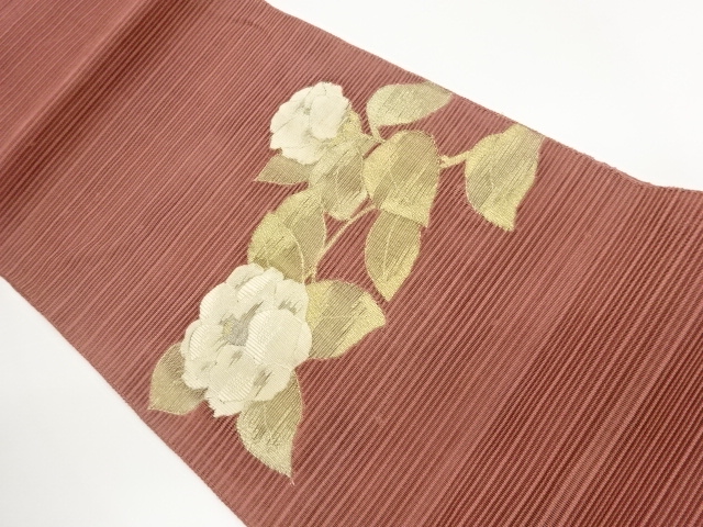 Rolos spelled camellia pattern woven Nagoya obi